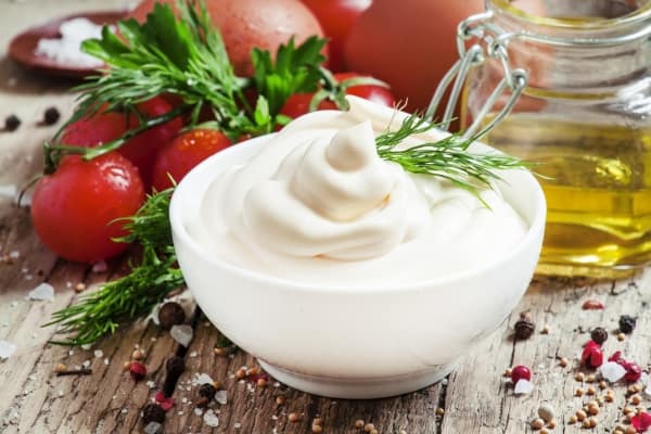 Homemade mayonnaise in a white bowl