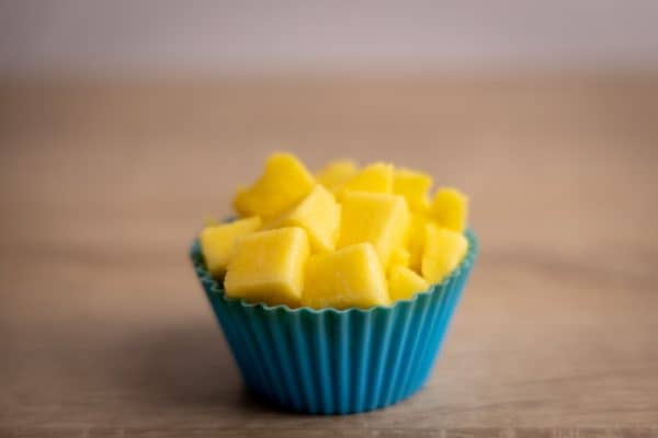 Mango cubes in a muffin silicone cup