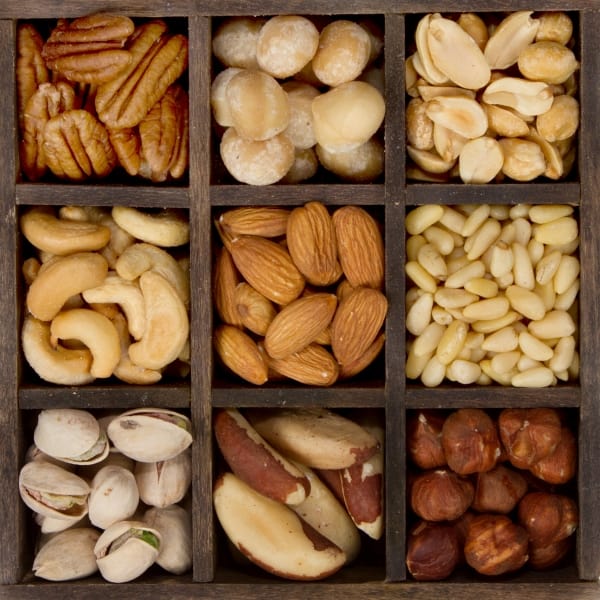 Nine varieties of nuts almond, cashew, brazil, hazelnut, peanut, pecan, pine, pistachio, macadamia