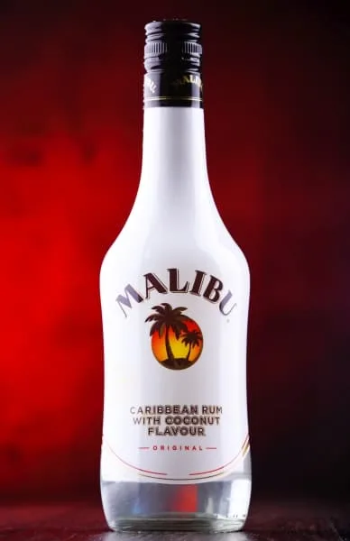 Bottle of Malibum rum on red background