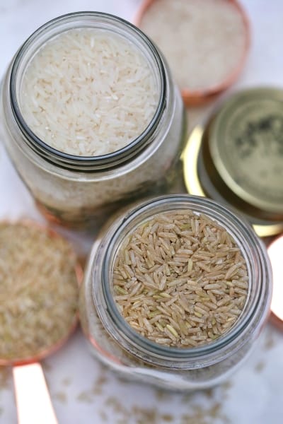 Brown and white rice in mason jars