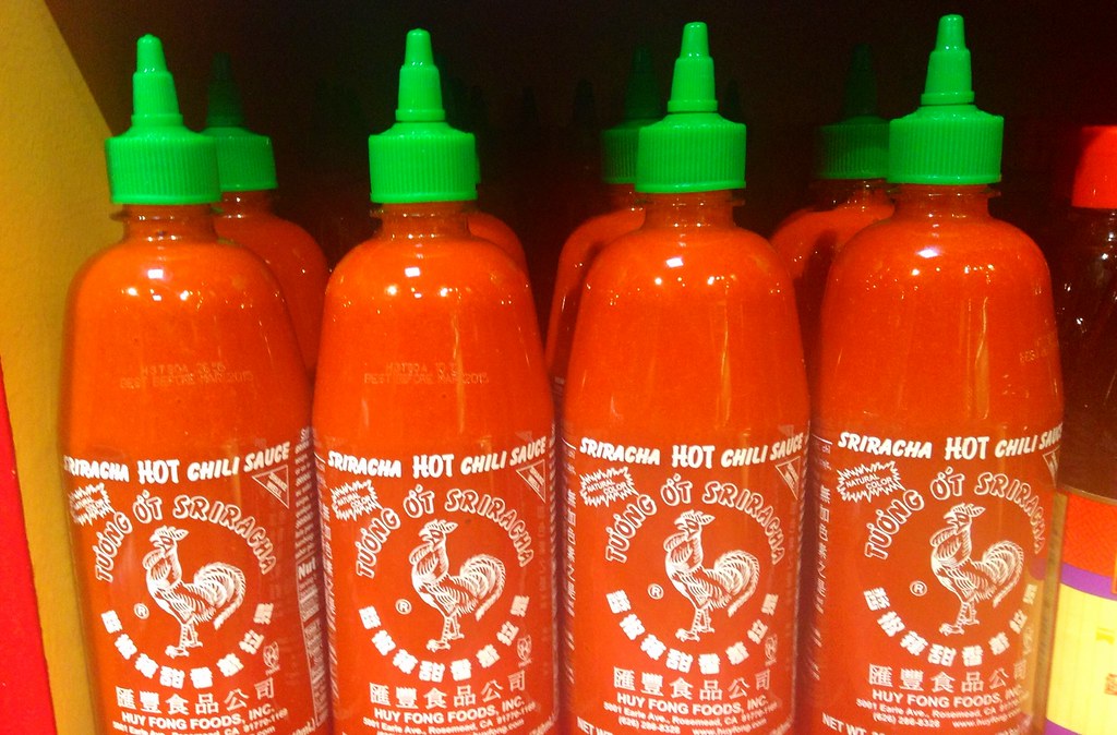 Bunch of Sriracha bottles