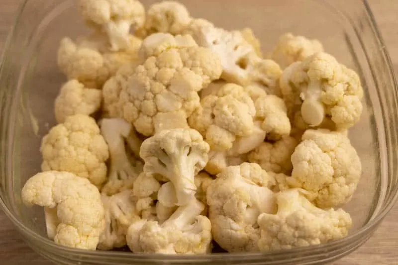 Cauliflower florets tossed with olive oil