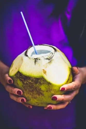 Coconut water with a straw