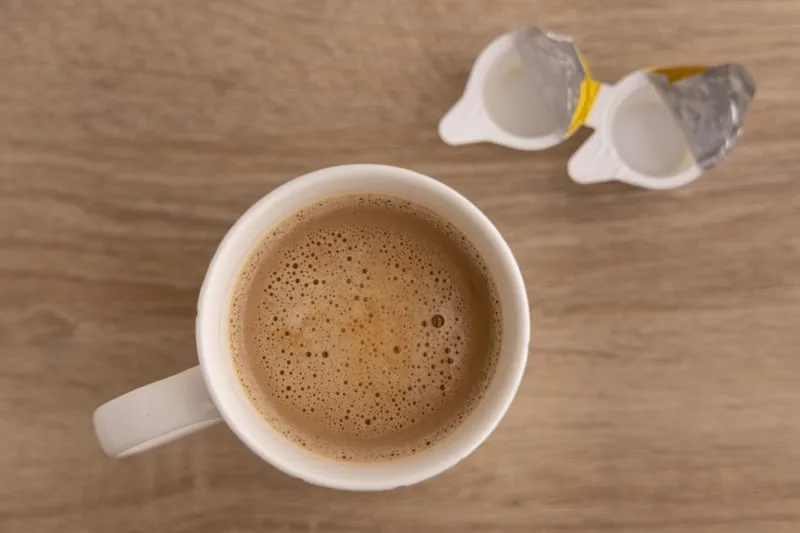 Coffee whitened with tiny creamers