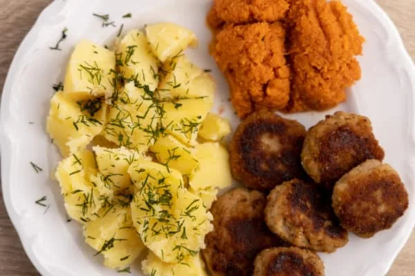 Dinner with meat, potatoes, and a salad