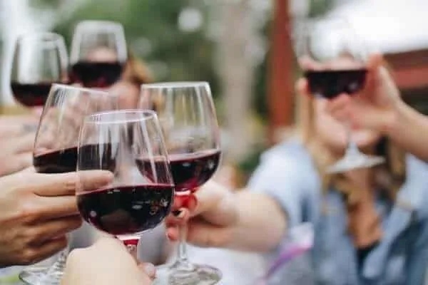 Drinking wine at a birthday party