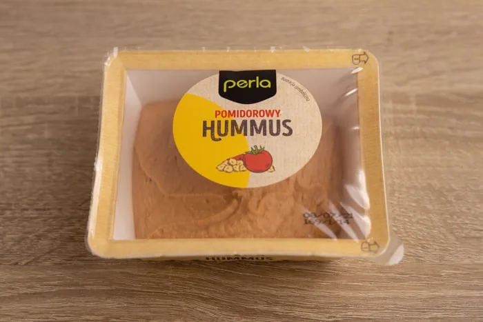 Tomato-flavored hummus contianer