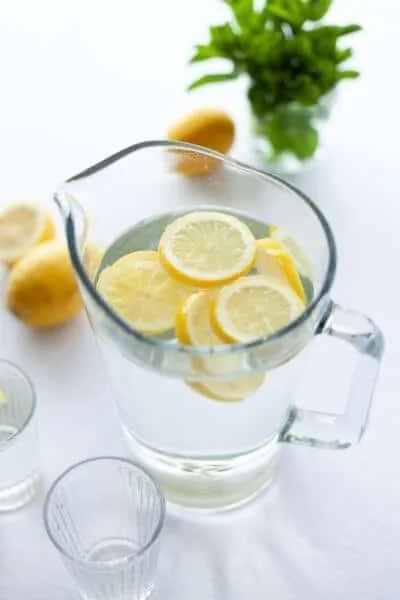 Lemon water in a glass pitcher