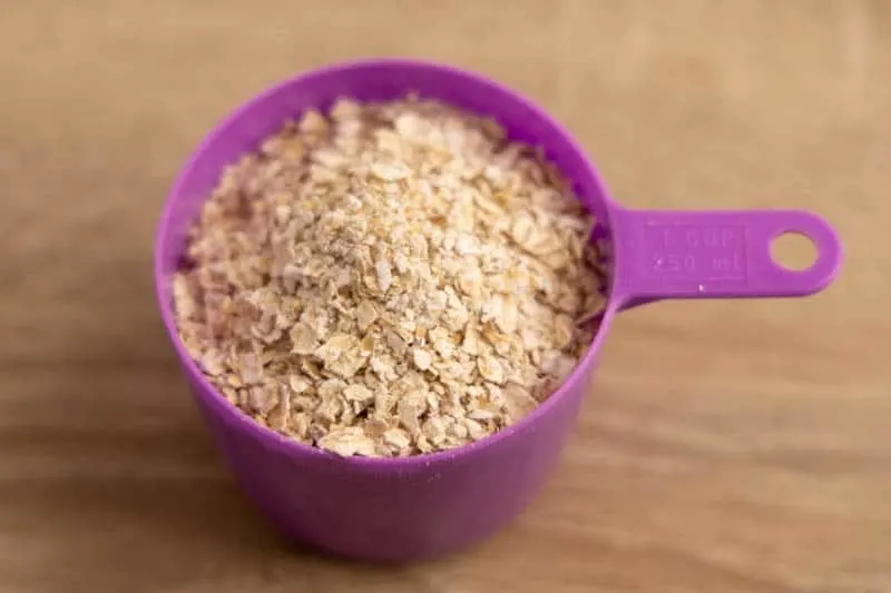 Measuring cup with oats