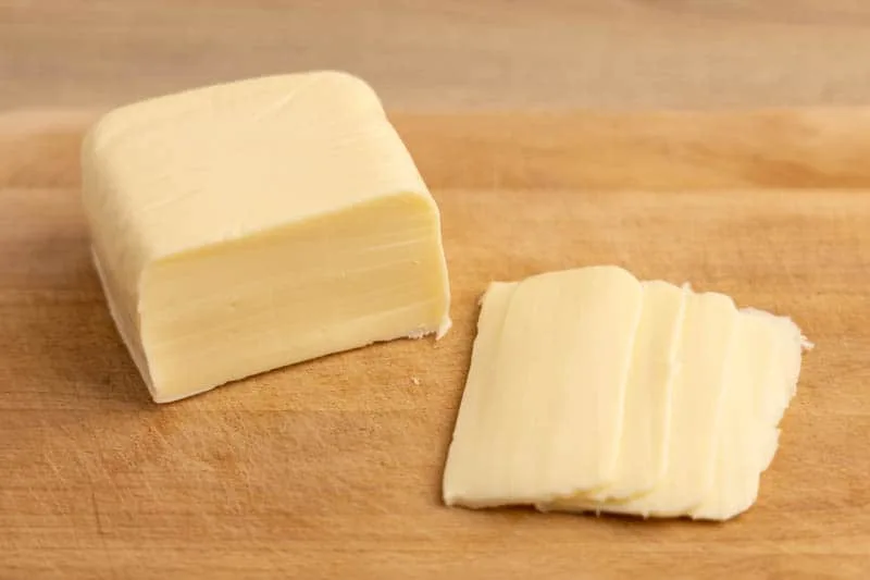 Mozzarella block on a cutting board