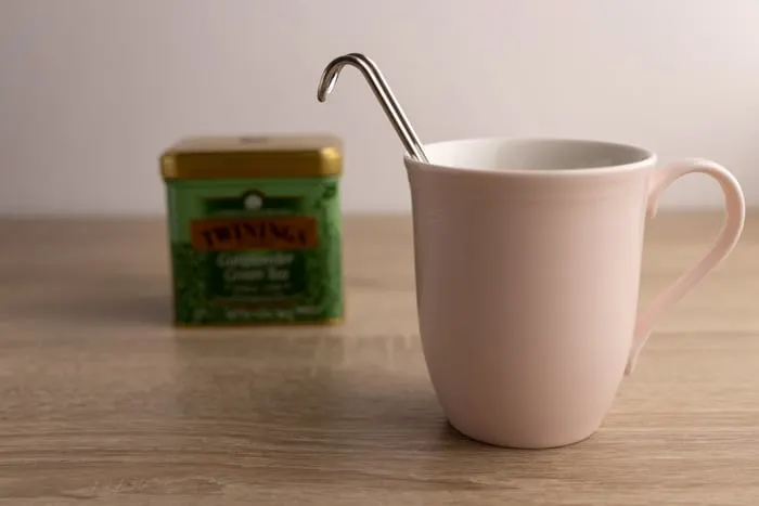 Mug, tea container, and an infuser