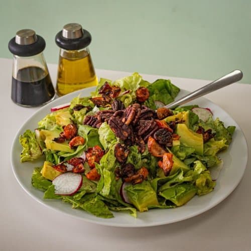 Pecan avocado salad and condiments
