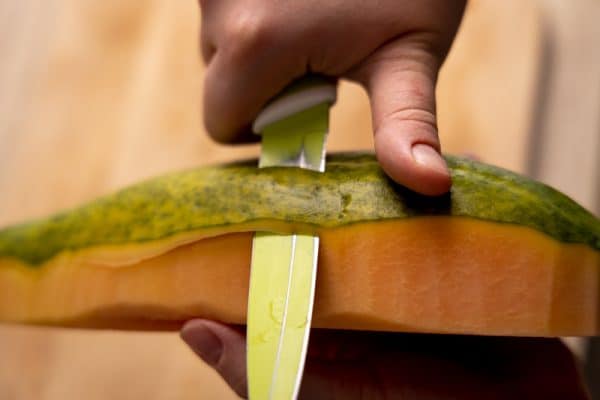 Peeling a papaya