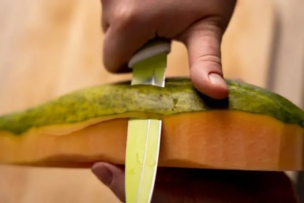 Peeling a papaya