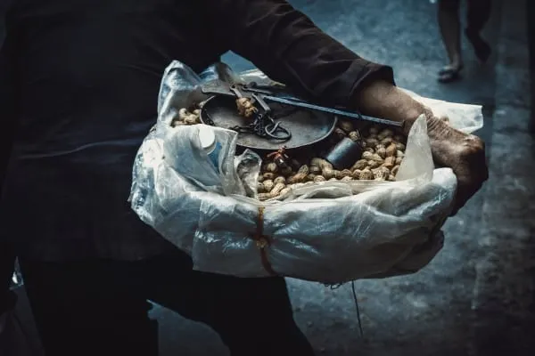 Person holding a big bowl of peanuts