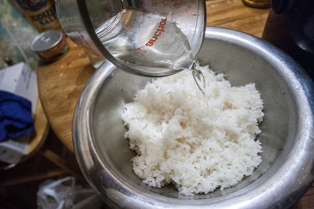 Pouring vinegar on rice