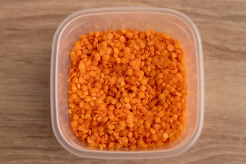 Red lentils in a storage container