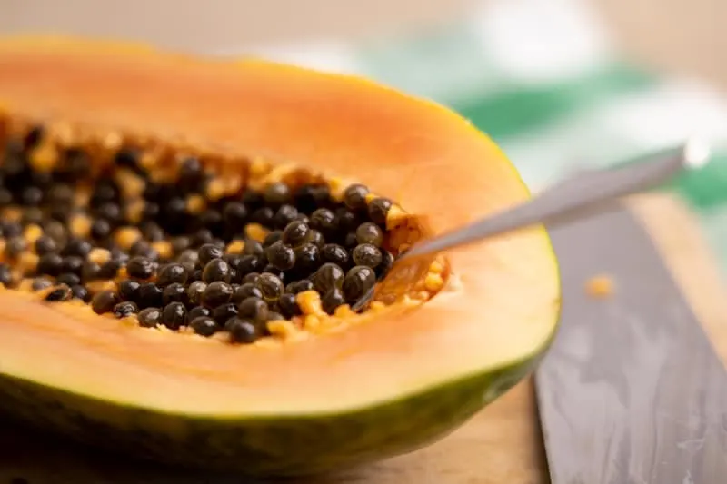 Removing seeds from a papaya