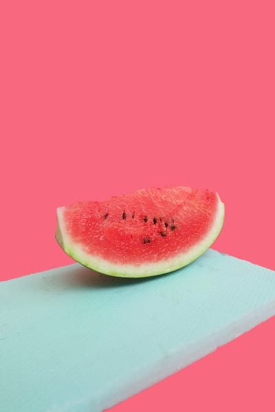 Sliced watermelon on red background