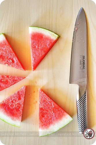 Sliced watermelon and a knife