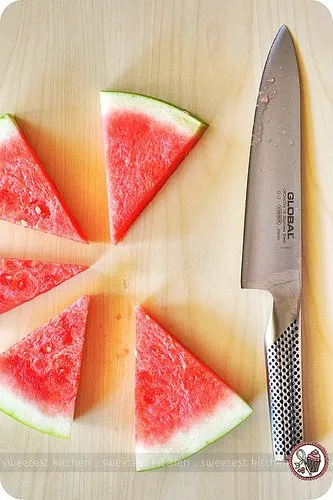 Sliced watermelon and a knife