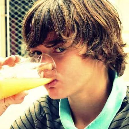 Kid drinking orange juice
